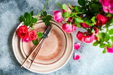 Summer table setting with red roses Stock Photos