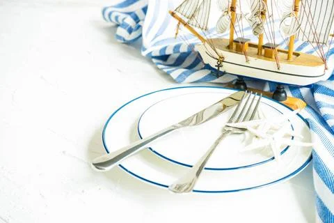  Summer table setting Summer marine table setting in rustic style on white... Stock Photos