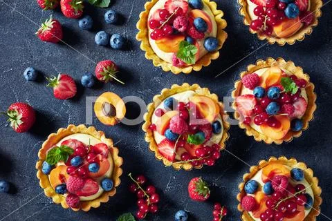 Summer tartls with fresh custard cream, berries Stock Photos