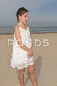 Summer teen girl in white dress posing Stock Photos