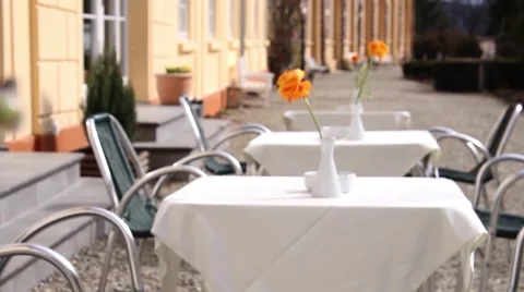 Summer terrace, equipped with tables covered with white tablecloths Stock Footage 59750331
