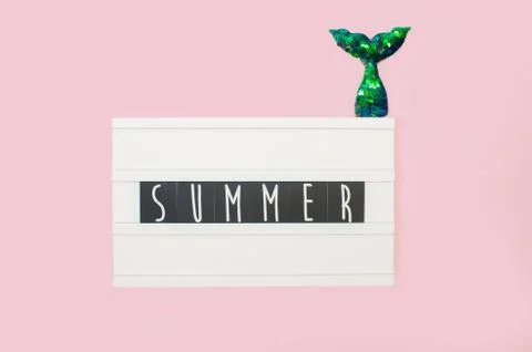 Summer - text on a display lightbox on pink bright background. Stock Photos