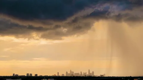Summer thunderstorm with heavy rain over Charlotte, NC at sunset Video stock 335833658