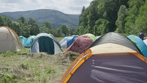 Summer is a time of adventure and open spaces. The camp with tents creates ideal Stock Footage 246969675