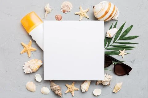 Summer time concept with blank greeting card and blank white paper on color.. Stock Photos