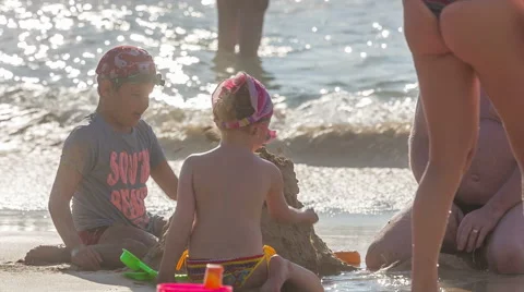 Summer time day light children playing on the beach hd phuket thailand Stock Footage 64565173