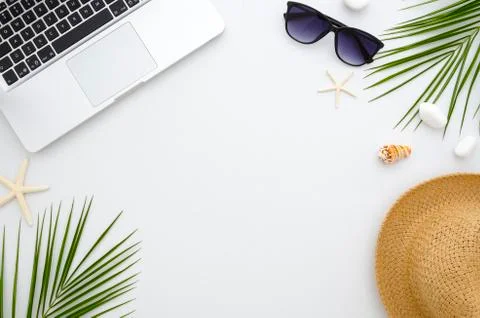 Summer time flat lay. Work and travel concept.Rest, sea, sun, beach and work Stock Photos