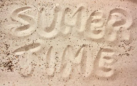 Summer time message in the sand Stock Photos