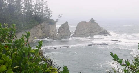 Summer time at Oregon Pacific coast with sea stacks caught in mist scenic vie Stock Footage 323567751