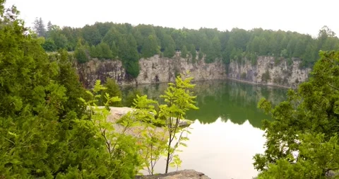 Summer time swimming quarry in Elora Ontario Canada Stock Footage