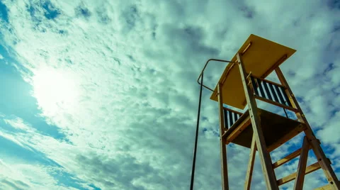 Summer timelapse, beach, lifeguard tower, sun, blue sky 24p Stock Footage 49978452