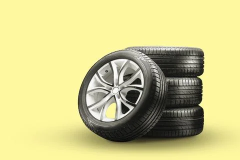 Summer tires and wheels-stack on a yellow background, new wheels Stock-Fotos