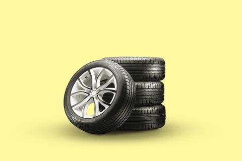 Summer tires and wheels-stack on a yellow background, new wheels Stock Photos