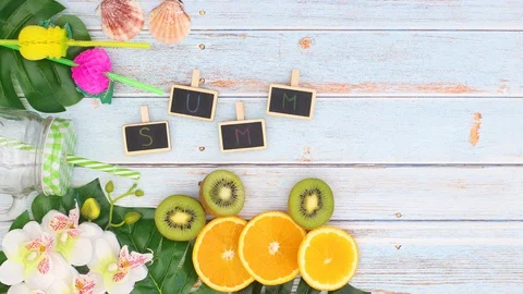 Summer title appear surrounded with vacation decoration and fruits - Stop motion Video stock 129136330
