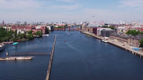 A summer trip with the drone above Berlin Osthafen, Oberbaumbruecke, aerial. Video stock 80604423