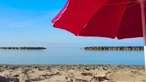 Summer Umbrella on the Beach. Part of a Red beach Umbrella. Stock Footage 244119785