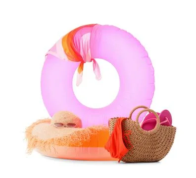 Summer vacation beach essentials with inflatable rings, straw hat, sunglasses Stock Photos