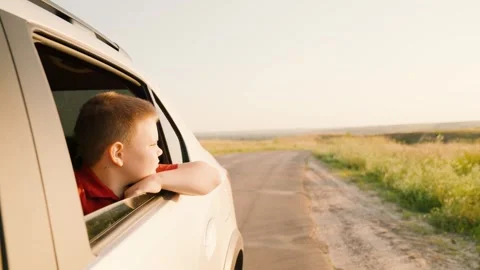 Summer vacation by car, back seat car, outdoors vacation, hand sun, children Stock Footage 276870685