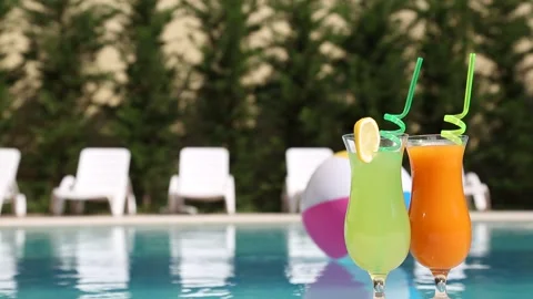 Summer Vacation Cocktails by the Pool Stock Footage 339701022