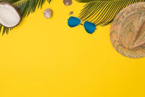 Summer vacation composition. Hat, palm leaves and sunglasses Stock Photos