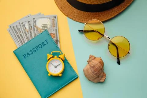 Summer vacation composition. Sunglasses, hat and passport with money banknotes Stock Photos