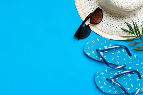 Summer vacation concept flat lay. straw hat beach accessories and towel top v Stock Photos