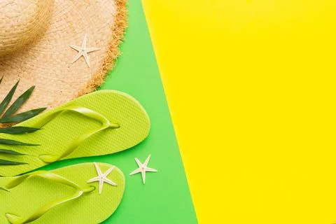 Summer vacation concept flat lay. straw hat beach accessories and flip flop.. Stock Photos