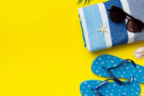 Summer vacation concept flat lay. beach accessories and towel top view. Space Stock Photos