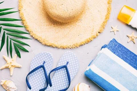 Summer vacation concept flat lay. beach accessories and towel top view. Spa.. Stock Photos