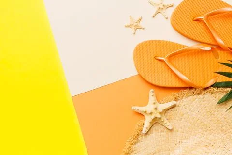 Summer vacation concept flat lay. straw hat beach accessories and flip flop.. Stock Photos