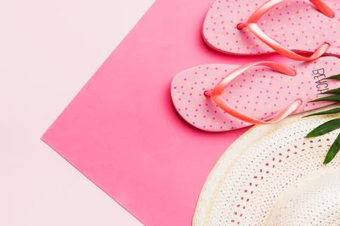 Summer vacation concept flat lay. straw hat beach accessories and flip flop.. Stock Photos