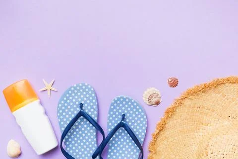 Summer vacation concept flat lay. straw hat beach accessories and towel top.. Stock Photos