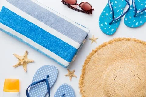 Summer vacation concept flat lay. beach accessories and towel top view. Space Stock Photos