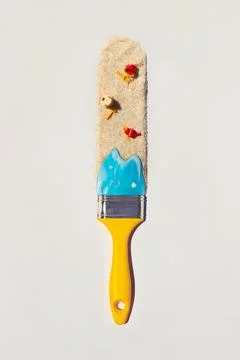 Summer vacation creative layout - paintbrush with sea and sand; Travel comp.. Stock Photos