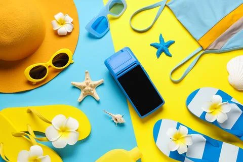 Summer vacation flat lay with beach accessories, payment terminal, and bright Stock Photos