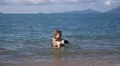 Summer Vacation - Girl with Dog in the Sea HD Footage
