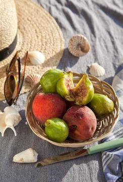 Summer vacation idea straw hat with sunglasses and fruits Stock Photos