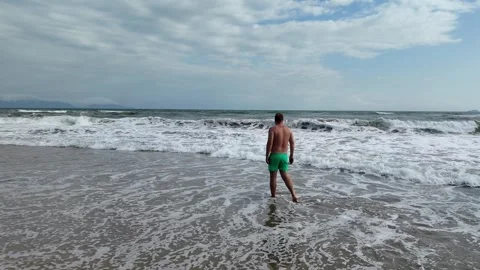 Summer Vacation, Man Walking on Beach Waves Stock Footage 274389544