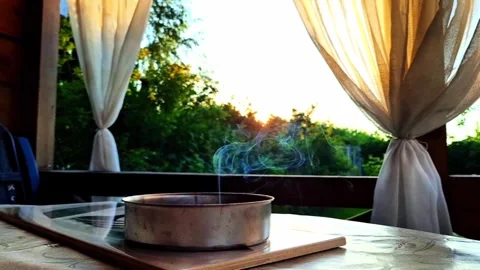 Summer veranda at sunset with smoke and fluttering curtains. Stock Footage 312878019