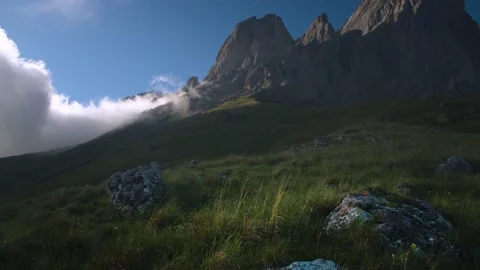 Summer video landscape low cloud cover flows around epic cliffs on a summer Stock Footage 156708875