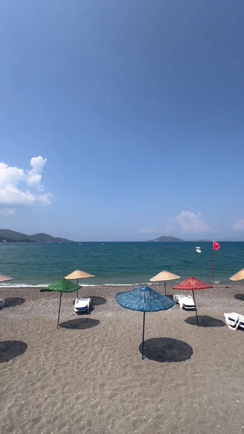 Summer view of a beach with umbrellas and lounge chairs 動画素材 337152135