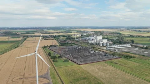 Summer View of Modern Wind Turbine and Industrial Power Infrastructure Stock Footage 340273691
