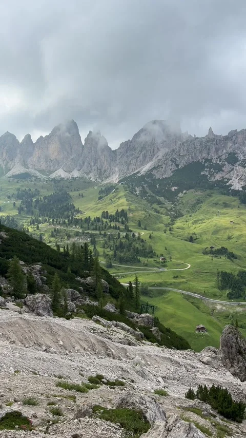 Summer view of Piz Boe and surrounding peaks with the scenic road from Corvara  Stock Footage 334794547