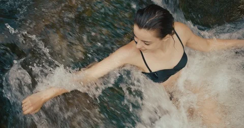 Summer vocation, mountain. Charming young brunette woman fixes her hair standing Stock Footage 102728783