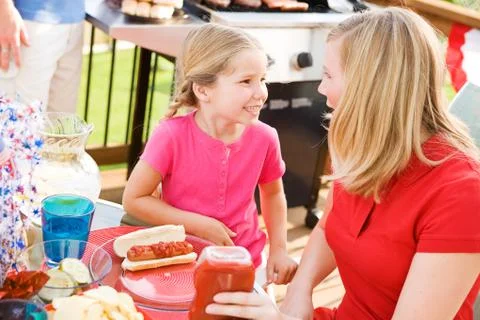 Summer: waiting to eat dinner on the deck Stock Photos