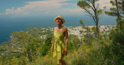 Summer walk on Monte Solaro where a woman enjoys sea panorama above white Capri Stock-Footage 342680059