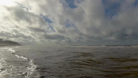 Summer, waves moving gently on the shore of a beach, majestic blue sky with.. Stock Footage 272276847