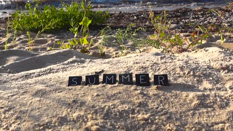 Summer word message written on sandy beach Stock Footage 347575521