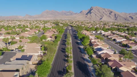 Summerlin Las Vegas Aerial Pullback View of Residential Road and Mountains 01 Видео 334584903