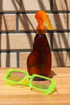 Summertime background with sunblock spray Stock Photos